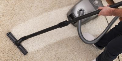 Close up of vacuuming a carpet